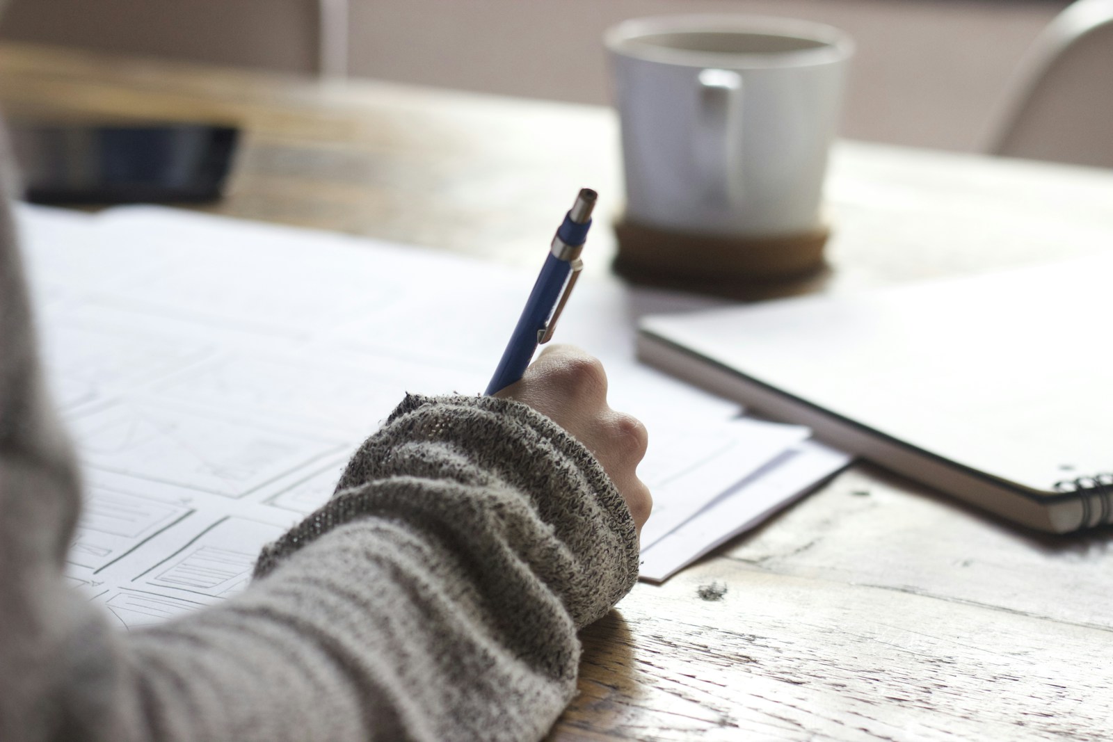 Mastery notebook and desk setup during facilitator-guided practice at Income AI Mastery